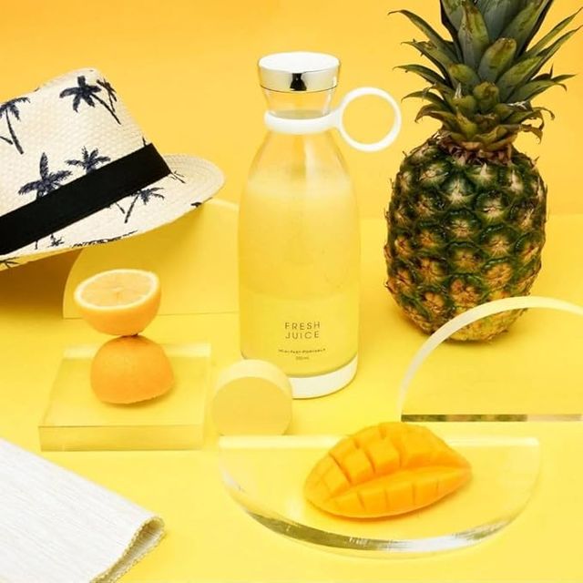 Portable mini blender bottle - in use with fresh fruit